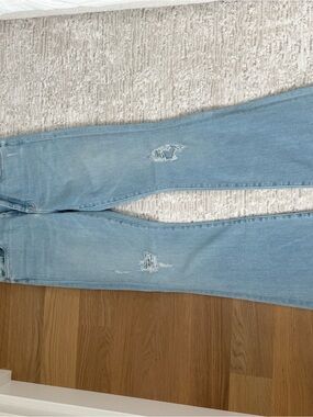 MOTHER Light Blue Flare Jeans with Knee Distressing